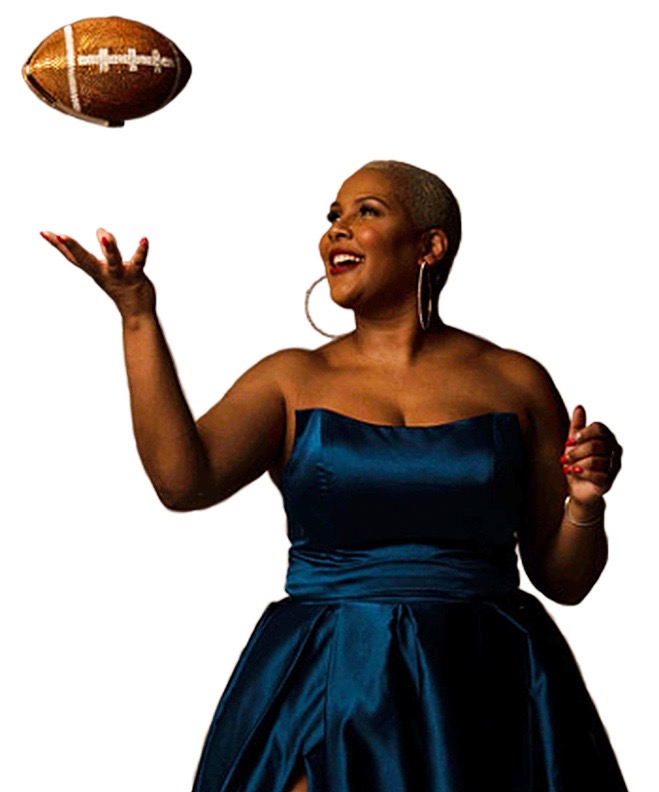 Reeta Hubbard holding a football